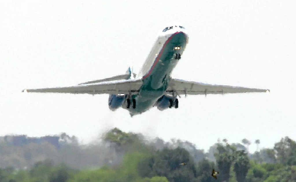 A Boeing B717 airplane takes off. A Boeing B717 airplane takes off.